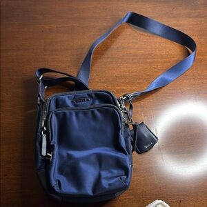 Tumi Blue Mini Bag with Adjustable Strap and Durable Fabric